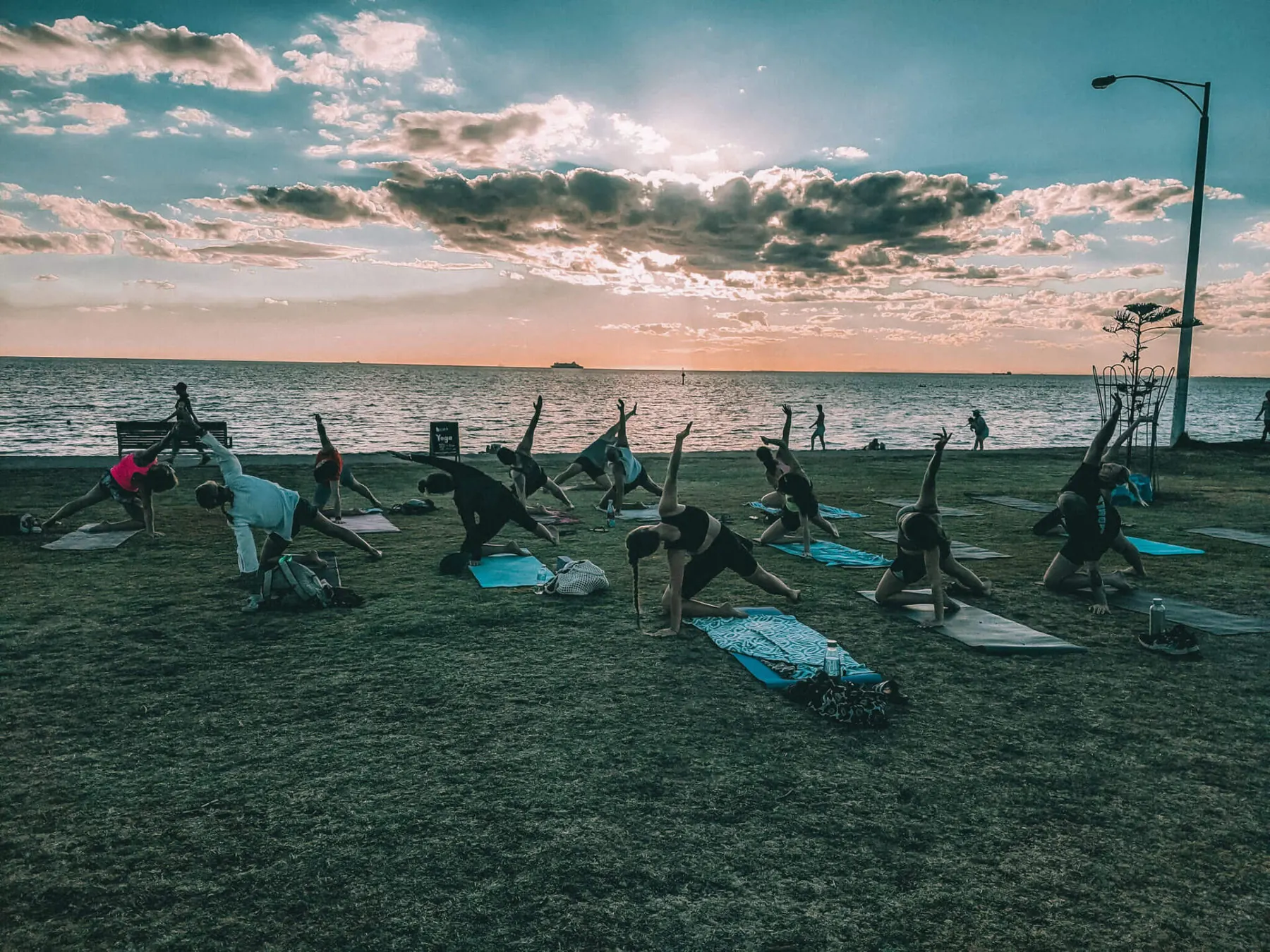 A Reset Wellness group yoga session on the beach at Elwood