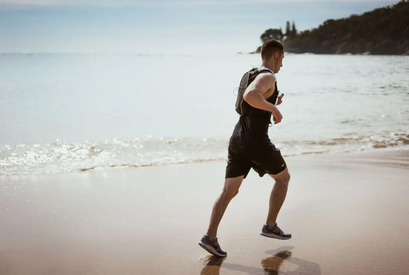 A man running along the beach